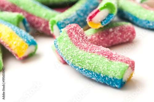 closeup of acidulous candies in shaped french fries on white background