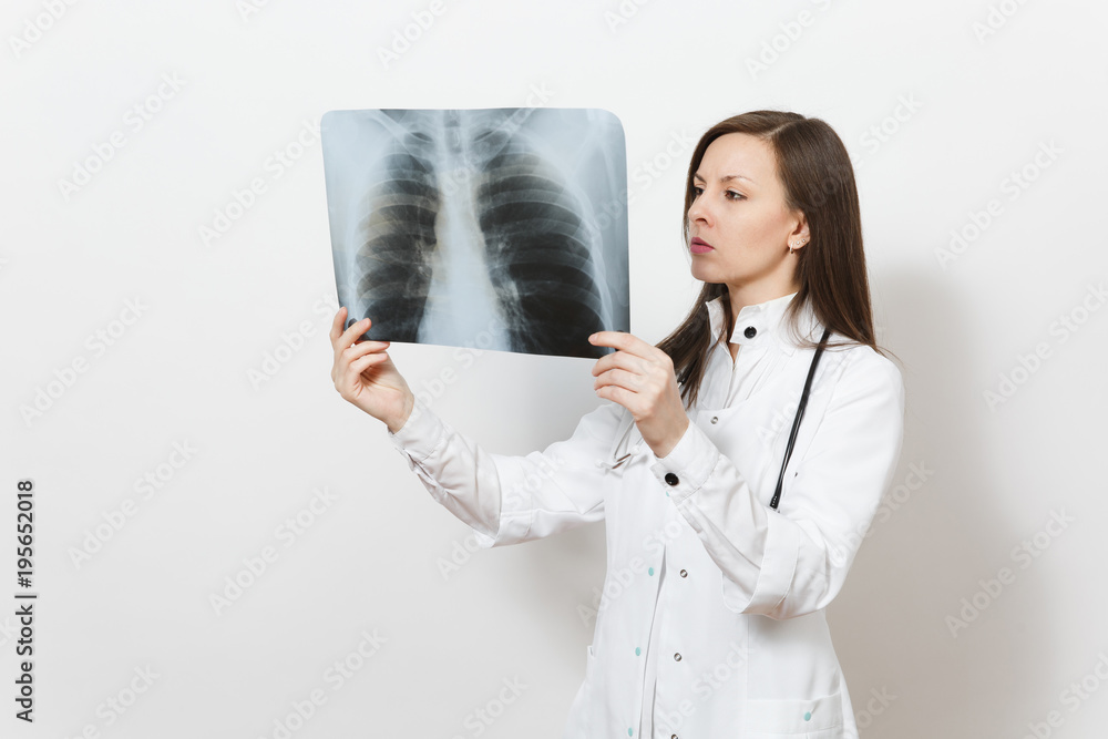 Perplexed focused doctor woman with X-ray of lungs, fluorography, roentgen isolated on white background. Female doctor in medical gown stethoscope. Healthcare personnel, medicine concept. Pneumonia. Perplexed focused doctor woman with X-ray of lungs, fluorography, roentgen isolated on white background. Female doctor in medical gown stethoscope. Healthcare personnel, medicine concept. Pneumonia.