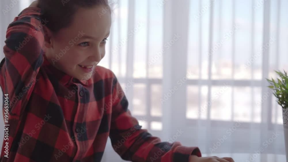 Boy using computer at home. Emotions Boy using computer at home. Emotions