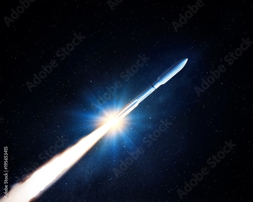Flying space rocket in the night starry sky. Space exploration background. Elements of this image furnished by NASA.