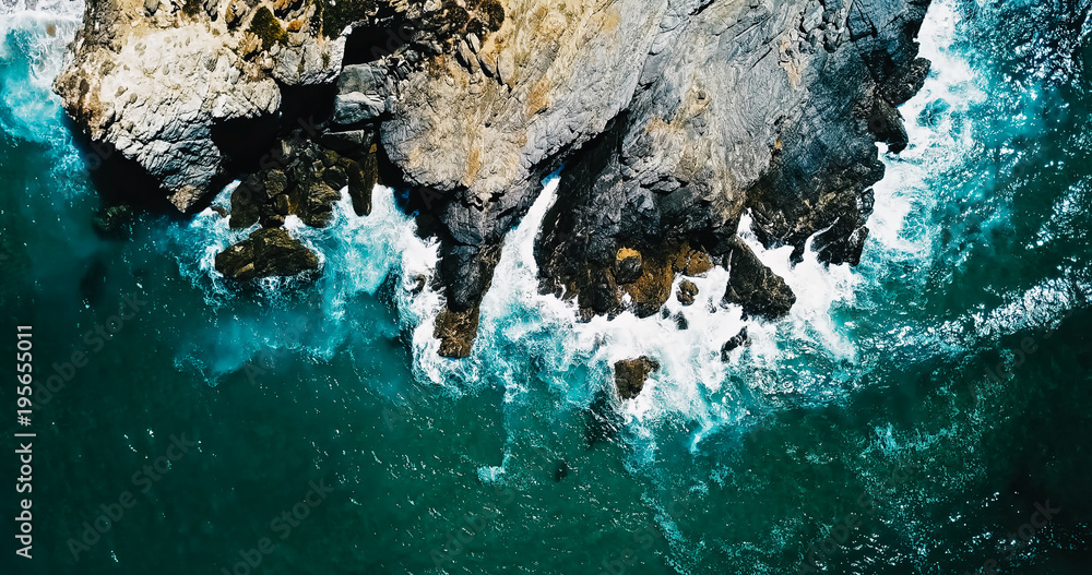 Aerial Drone View Of Dramatic Ocean Waves Crushing On Rocky Landscape - obrazy, fototapety, plakaty 