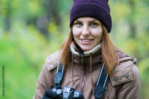 beautiful woman tourist travel photographer photographing forest at autumn day