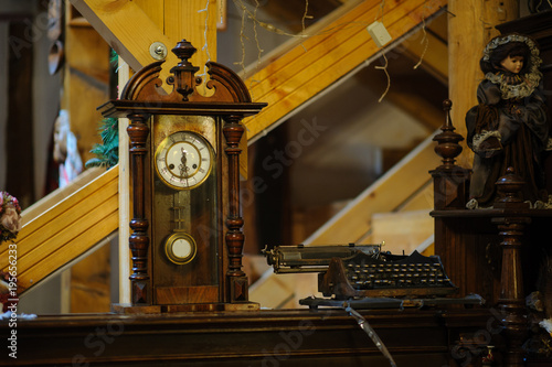 Antiquarian wooden clock with a pendulum
