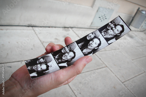 Photo booth strip with the photos of a young couple