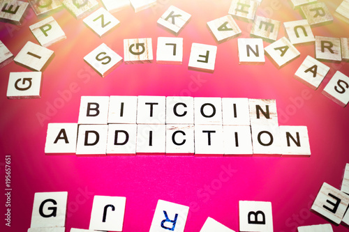 Wooden blocks on a red background spelling words Bitcoin addicion