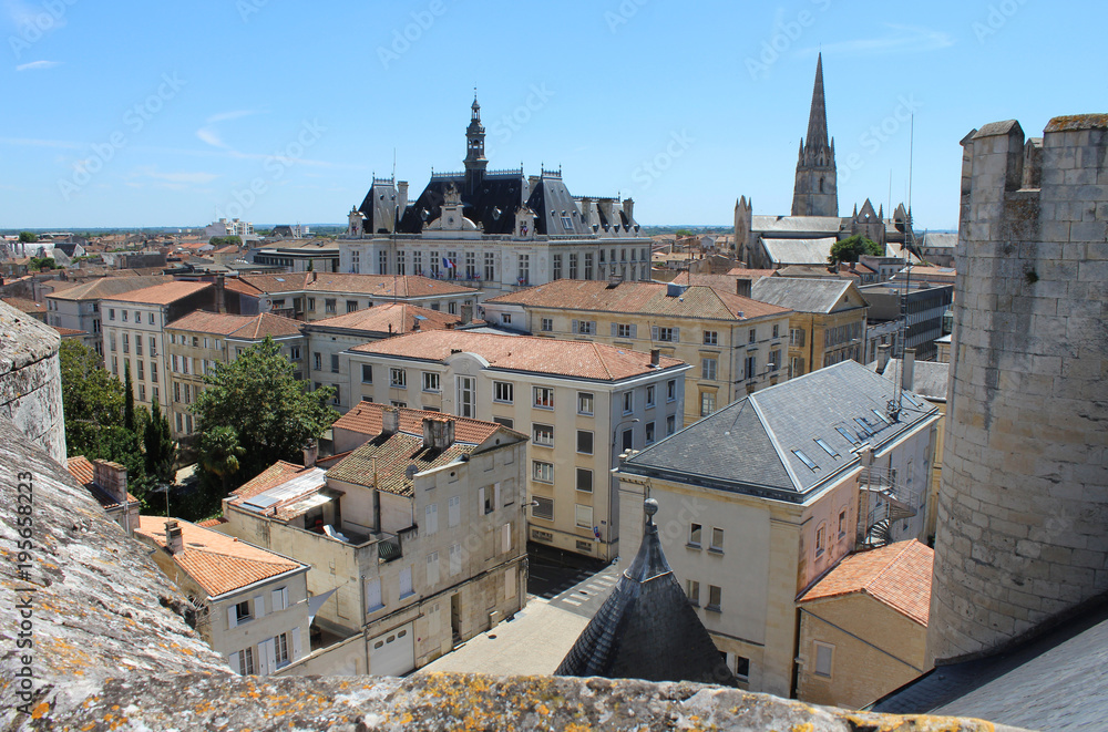 Rooftop view of the historic town of Niort, its Town Hall, and the spire of Notre Dame Church. Niort is a large town in the Deux-Sèvres department in western France.