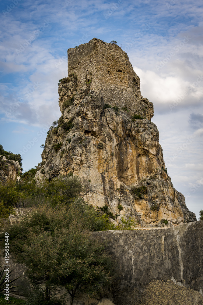 Old tower on a stone ciff 
