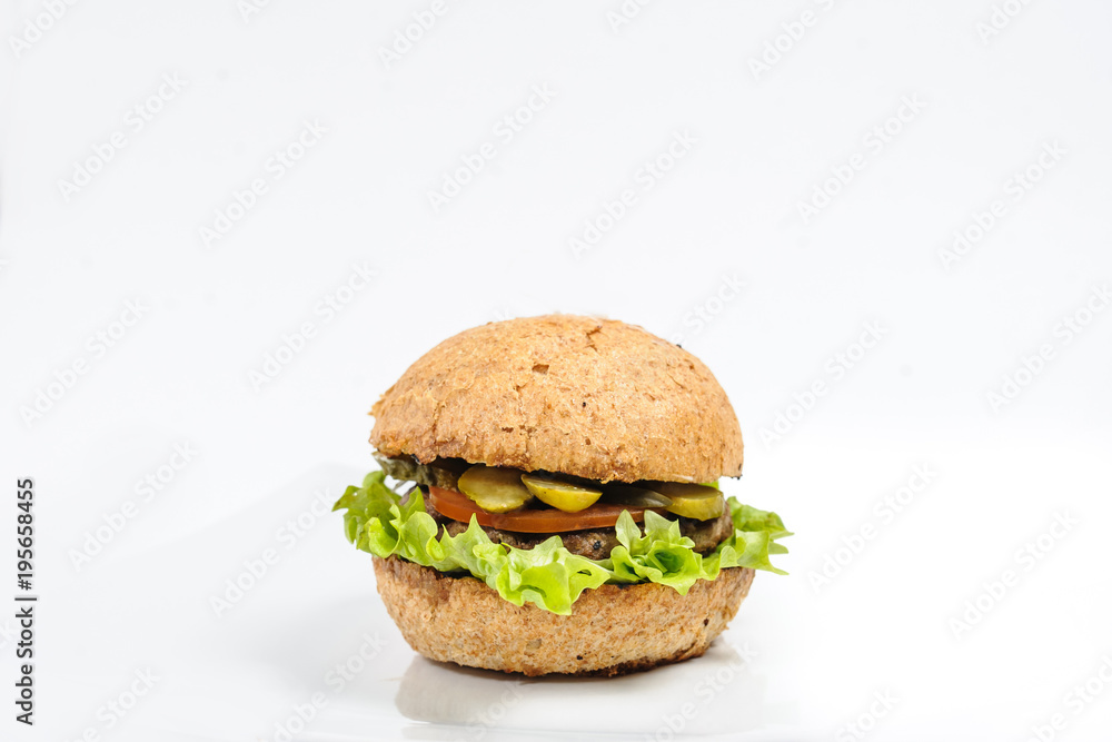 Perfect hamburger/ burger with cheese, bacon, tomato, salad, cucumber Perfect hamburger/ burger with cheese, bacon, tomato, salad, cucumber