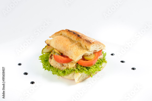 Delicious ham sandwich with tomatoes and salad