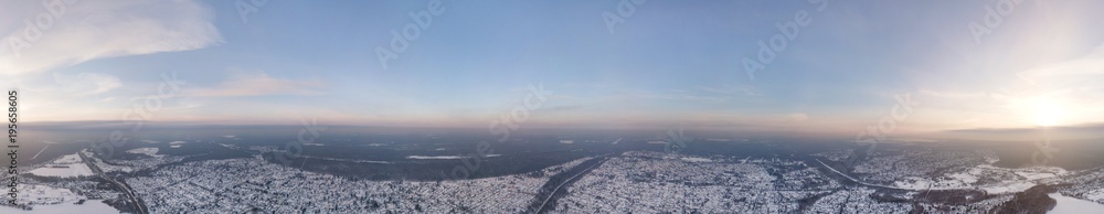 panoramic view from the air to the snow-covered village