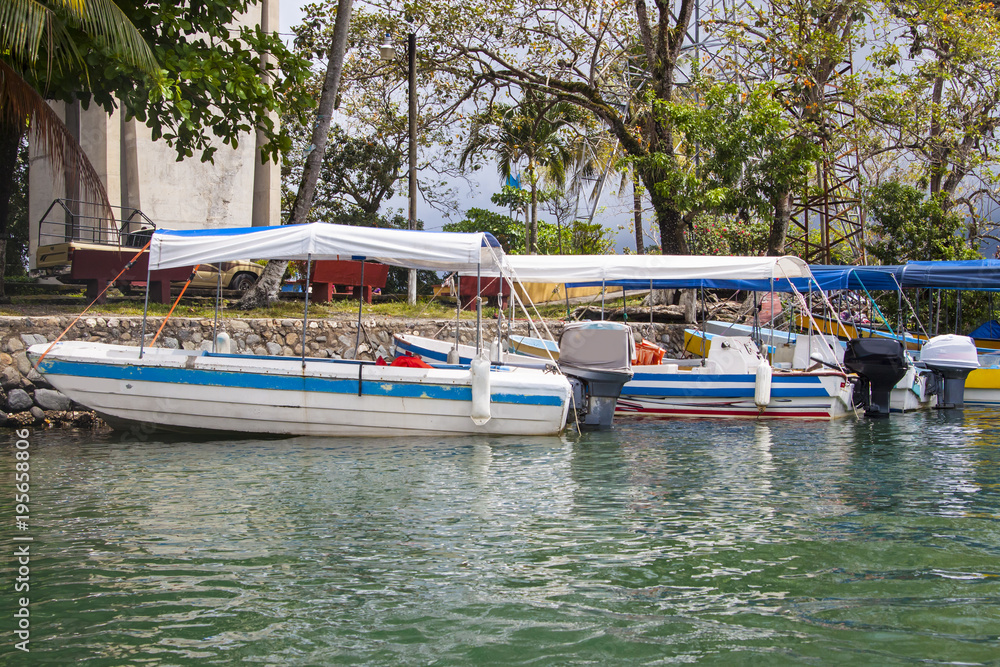 Boats docked in Rio Dulce, Guatemala Boats docked in Rio Dulce, Guatemala