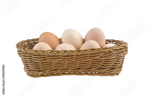 Wallpaper Mural chicken eggs in a wicker basket isolated on a white background Torontodigital.ca