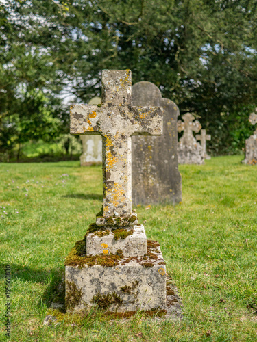 Stone cross with moss and lichen