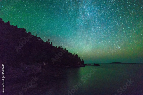 Milky way and starry sky along the lakeshore of Georgian Bay at night photo