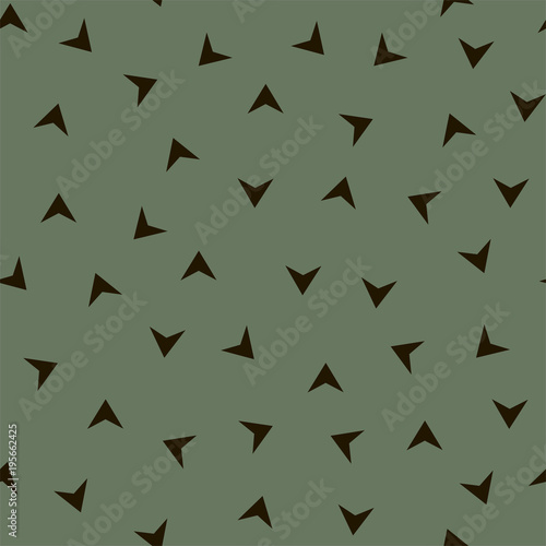 Seamless pattern with black triangles on a green background. Vector.
