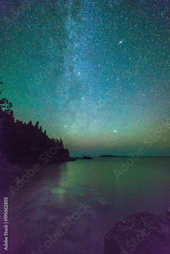 Milky way and starry sky along the lakeshore of Georgian Bay at night photo