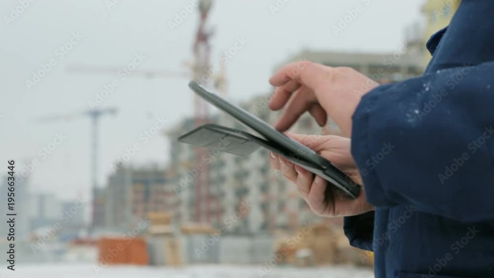 Foreman with pad at major construction project Foreman with pad at major construction project