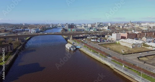 Aerial footage of  traffic crossing the Kingston Bridge over the River Clyde in Glasgow.  photo