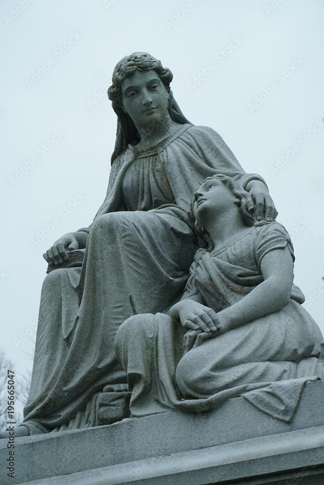 gravestones with stone angels and women tombstones