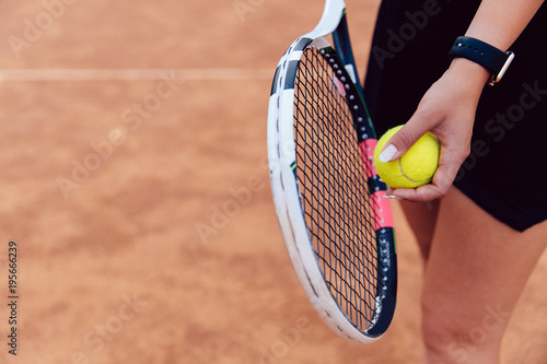 View from above on woman prepares to serve during the match on the tennis court. © Maksym Azovtsev