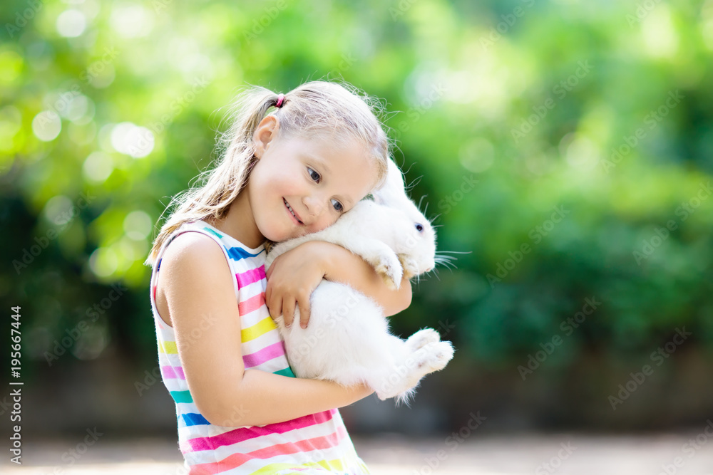 Child with rabbit. Easter bunny. Kids and pets. Child with rabbit. Easter bunny. Kids and pets.