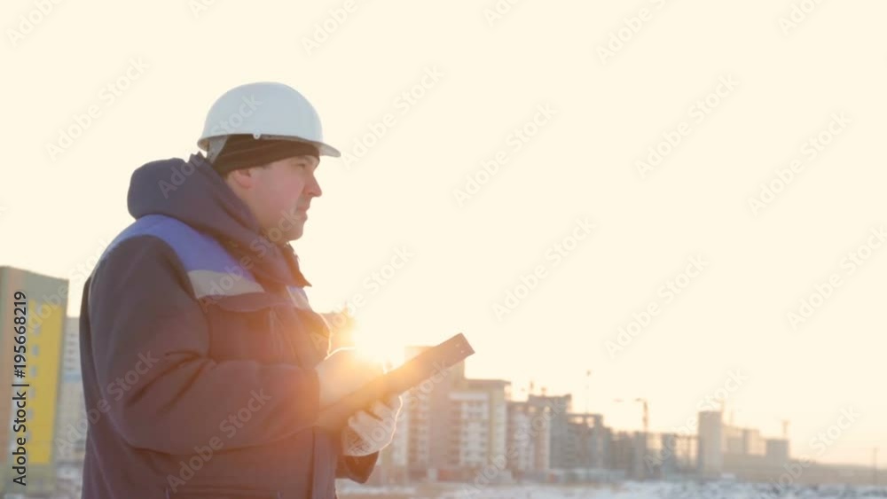 Foreman with tablet at major construction project Foreman with tablet at major construction project