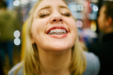 young woman showing off her braces