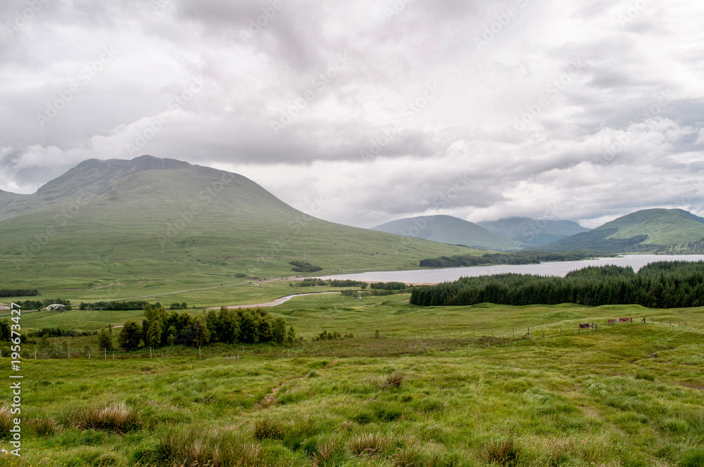A view of the typical Scottish landscape in cloudy weather - Glen Coe area A view of the typical Scottish landscape in cloudy weather - Glen Coe area