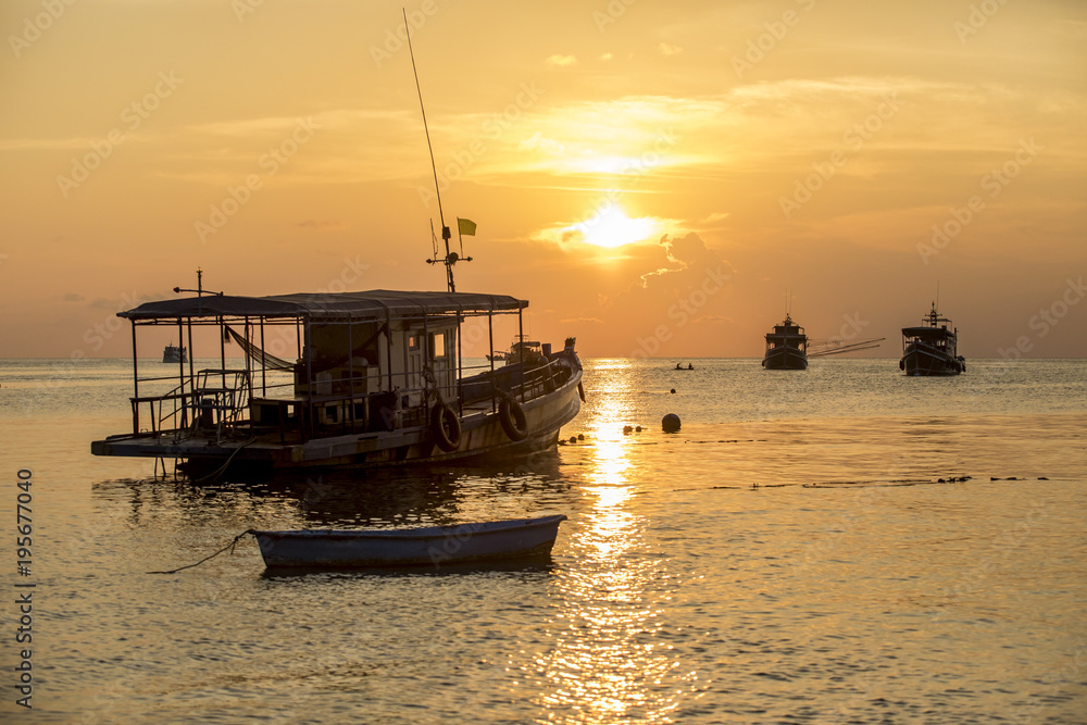 sea boat floating in harbor port against beautiful sunset sky at koh tao thailand