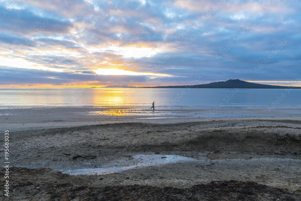 Sunrise Time at Takapuna Beach Auckland New Zealand - View to Rangitoto Island Sunrise Time at Takapuna Beach Auckland New Zealand - View to Rangitoto Island