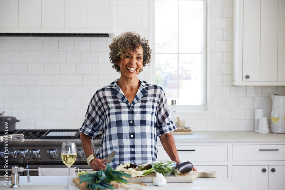 African American senior woman cooking in the kitchen African American senior woman cooking in the kitchen