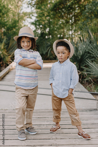 Two adorable boys posing in their cool stances. photo