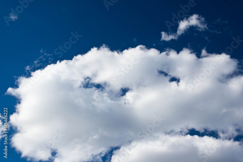 bright clouds in dark blue sky