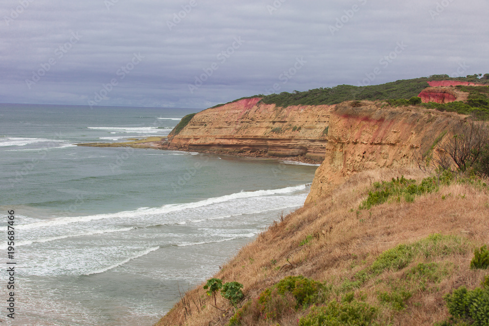 Red cliffs and a Cloudy day along Victorian Coastline in Australia.