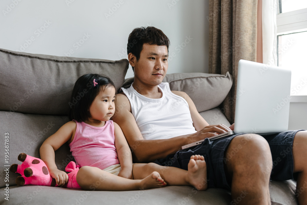 Adorable girl and her father at home Adorable girl and her father at home