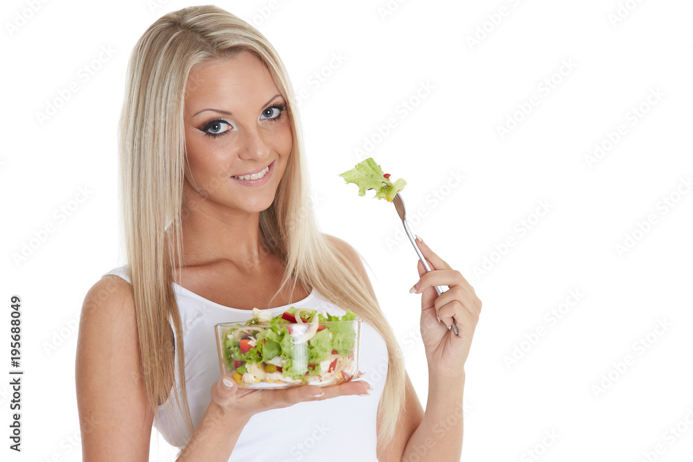 Slender woman holds a bowl of salad. Slender woman holds a bowl of salad.