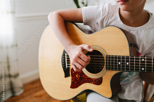 Young Girl Playing Guitar