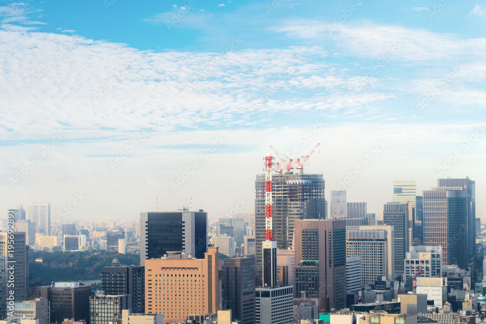 Obraz premium Aerial skyscraper view of office building and downtown and cityscapes of Tokyo city with blue sly and clouds background. Japan, Asia