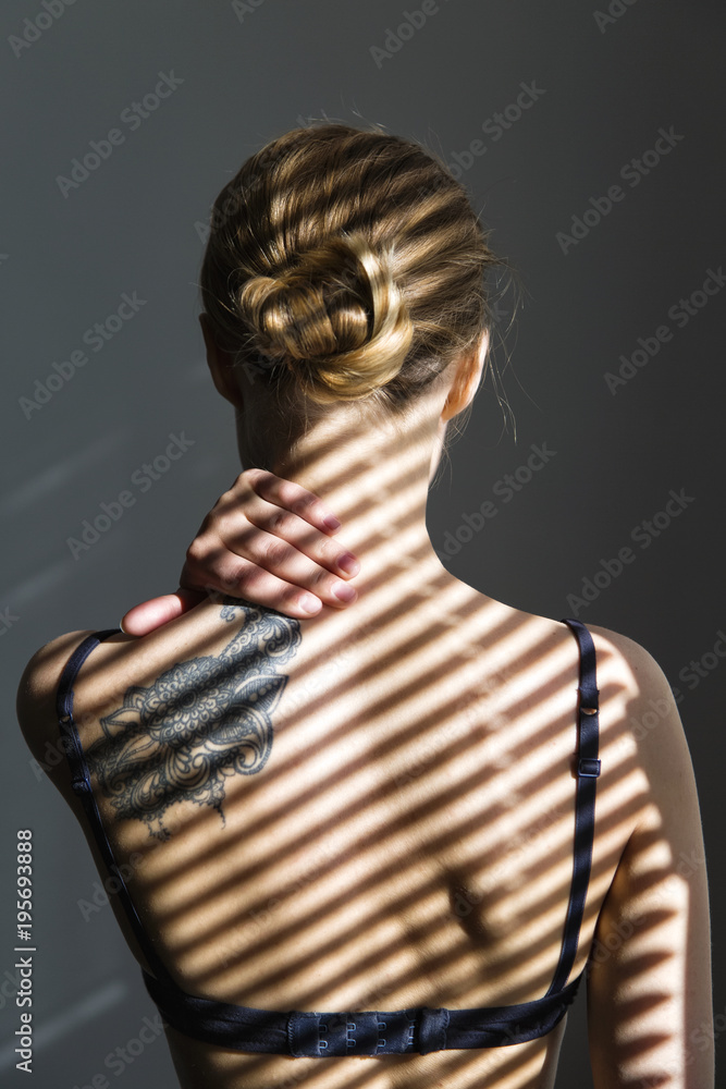 Unrecognizable woman in shadow lines Unrecognizable woman in shadow lines