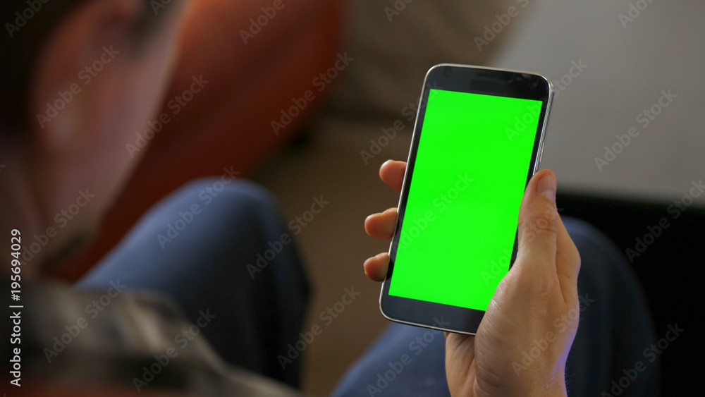 Man Using Smart Phone with Chroma Green Screen Man Using Smart Phone with Chroma Green Screen