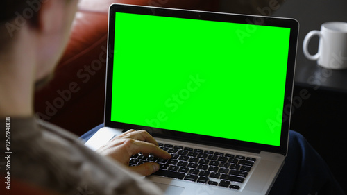 Wallpaper Mural Man Using Laptop with Chroma Green Screen Torontodigital.ca