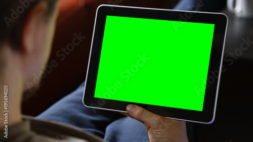 Man Using Large Tablet with Chroma Green Screen