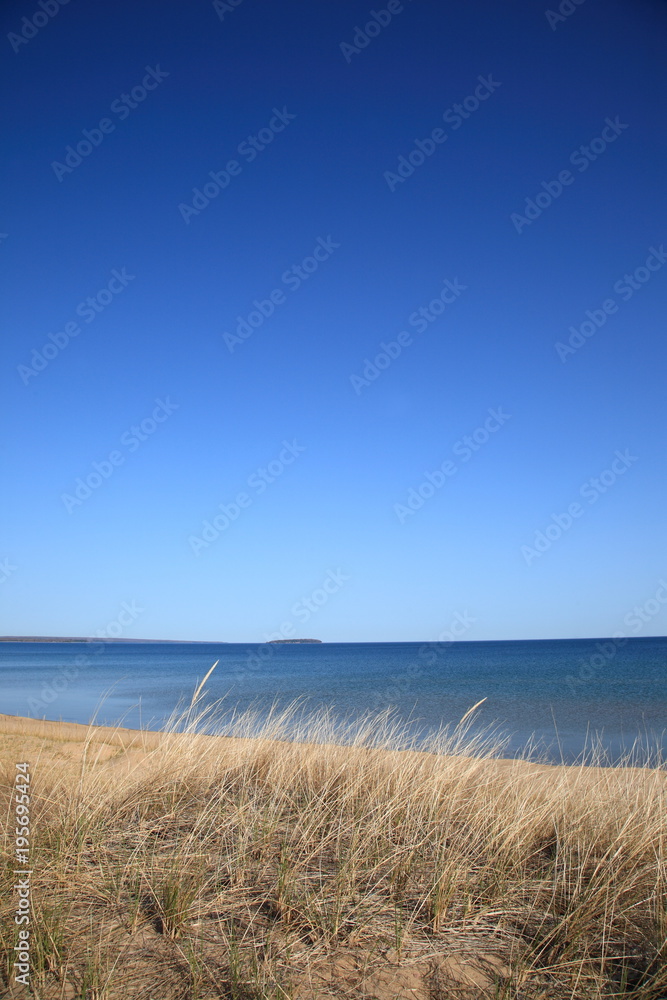 Lake Superior - Grassy shoreline and beach of a North American Great Lake. Lake Superior - Grassy shoreline and beach of a North American Great Lake.