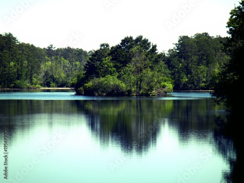 photo of an island in the middle of a beautiful lake