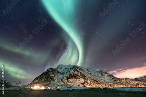 Northen light under mountains. Beautiful natural landscape in the Norway