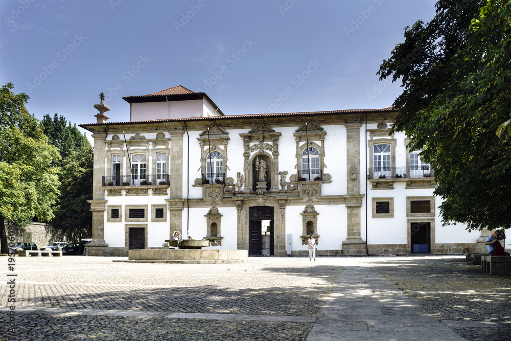 Guimaraes, Braga, Portugal. August 14, 2017: Cobblestone cobbled square with old building in the center of the city on a sunny day
