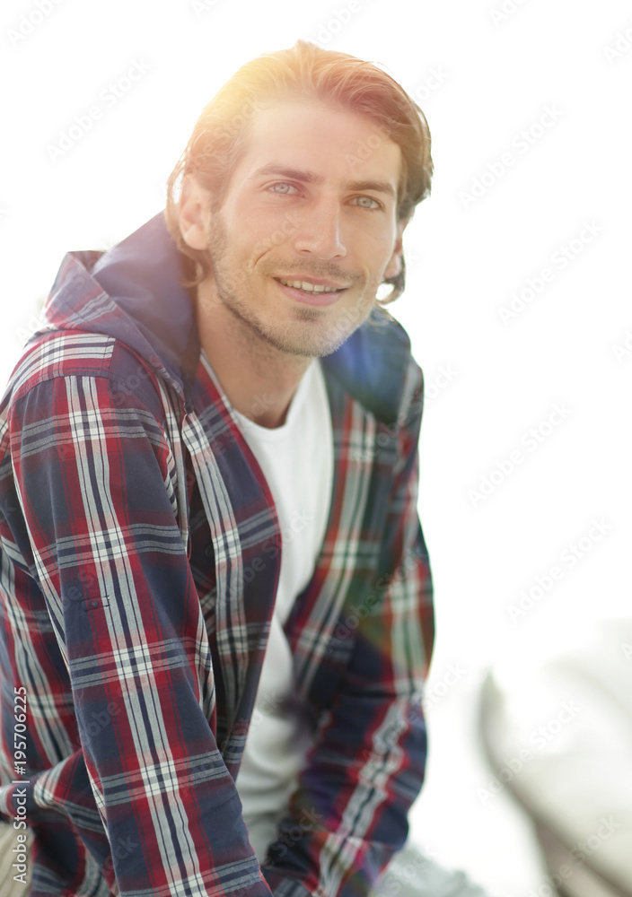 portrait of a successful guy in a checked shirt.