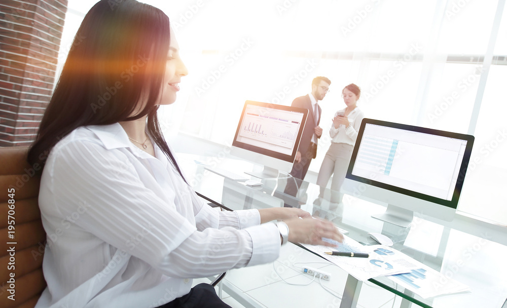 business woman working with financial charts in a modern office