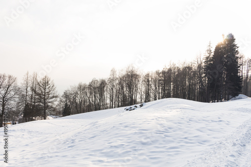 Photo of snowy landscape with blue sky and road in winter © Roman's portfolio