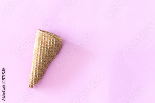 Waffle cone ice cream on pink background